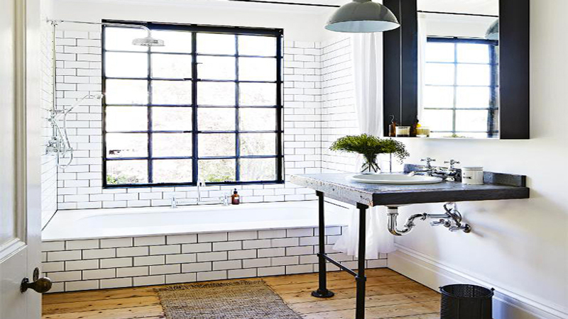 carrelage et faïence blanc pour salle de bain avec joints couleur noir assorti à la couleur de peinture et au plan sous-vasque noir