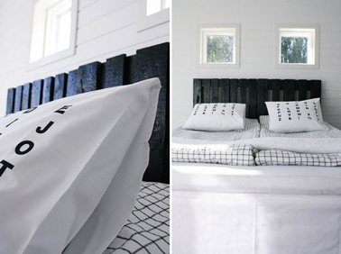 Tête de lit palettes peintes noir aspect brillant pour une déco chambre noir et blanc 