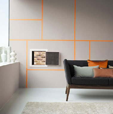 Couleur peinture gris dans salon. Pour la décoration d'un salon design peinture murale gris souris rehaussée par jeu de lignes couleur orange canapé et coussins gris et orange