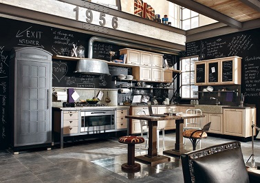 Déco cuisine industrielle Vintage et originale, cette cuisine industrielle combine des éléments variés. De l'acier, du bois clair et une peinture ardoise il n’en faut pas plus pour une déco réussie.