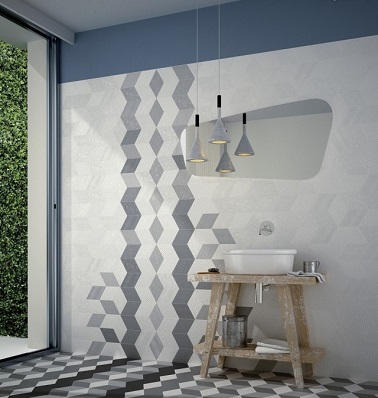 Un carrelage à motifs graphiques, une bonne idée pour relooker sa salle de bain. Des couleurs sobres et trompe l'oeil suffisent à rendre la pièce unique ! 