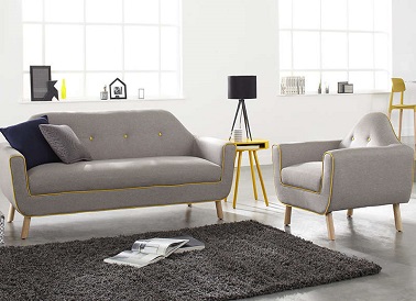 La tendance vintage n'est pas incompatible dans un salon design. Ce canapé en tissu gris en est la preuve car il adopte un style et une forme moderne et rétro à la fois.