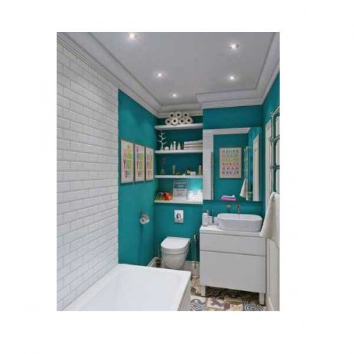 Une petite salle de bain moderne astucieusement aménagée avec niche de rangement dans mur bleu turquoise, meuble lavabo compact et petite baignoire. Au sol des carreaux de ciment lui donnent un cachet authentique