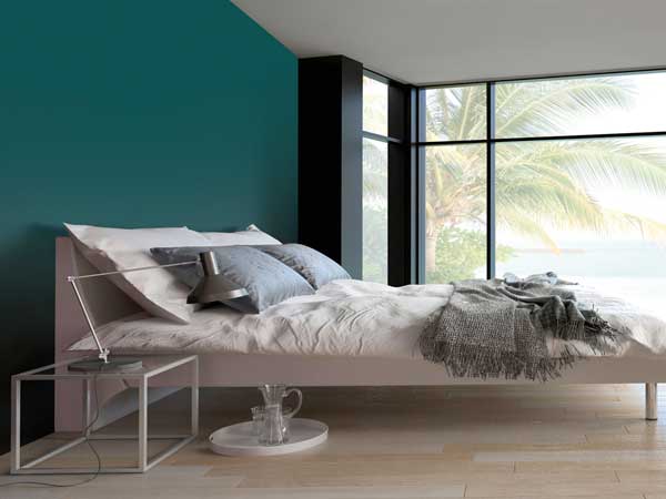 Une peinture gris urbain pour faire la tête de lit dans cette chambre parentale design. Une couleur profonde et chic idéale dans une déco contemporaine épurée