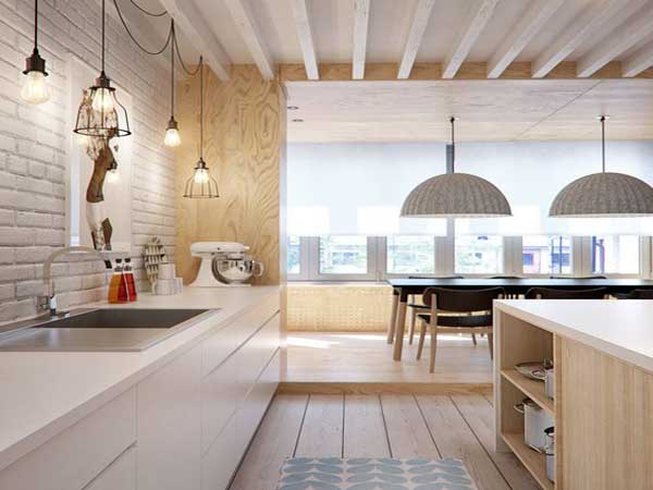 Meuble façades bois et parquet réchauffent une cuisine blanche style loft
