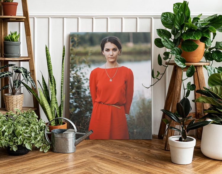 A person standing in front of a window with potted plants
Description automatically generated with low confidence